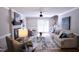 Inviting living room features a fireplace, ceiling fan, and access to the outdoors at 3832 Doeskin Dr, Apex, NC 27539