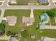 Neighborhood aerial view, highlighting landscaping, green lawns, and mature trees at 402 S Wilma St, Angier, NC 27501