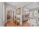 Spacious hallway with hardwood floors, connecting living areas and showcasing a stylish interior design at 402 S Wilma St, Angier, NC 27501