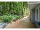 Spacious backyard deck with manicured landscaping, including a brick raised flower bed at 4021 Converse Dr, Raleigh, NC 27609