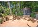 Backyard deck featuring a gazebo surrounded by trees and a wooden fence at 4021 Converse Dr, Raleigh, NC 27609