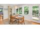 Cozy dining area with large windows providing a view of the outdoor greenery at 4021 Converse Dr, Raleigh, NC 27609