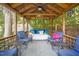 Charming gazebo with comfortable seating, a ceiling fan, and decorative lighting at 4021 Converse Dr, Raleigh, NC 27609