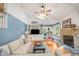 Cozy living room area with a fireplace, vaulted ceilings, and built-in shelves at 4021 Converse Dr, Raleigh, NC 27609
