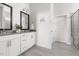 Elegant bathroom featuring double vanity with gray countertops and tiled flooring at 427 Bluffberry Way, Hillsborough, NC 27278