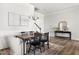 Elegant dining room with a stylish table, chairs, modern light fixture and wainscoting walls at 427 Bluffberry Way, Hillsborough, NC 27278