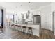 Beautiful kitchen with a spacious island, bar stool seating, and stainless steel appliances at 427 Bluffberry Way, Hillsborough, NC 27278