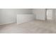 Loft area with neutral carpet, base trim, and ample natural light at 427 Bluffberry Way, Hillsborough, NC 27278