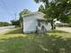 Side view of a home with a small awning over the entrance and a green, grassy yard at 429 5Th & Brogden Rd, Smithfield, NC 27577