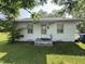 Front exterior view of a simple, white-painted home with a small porch and lawn at 429 5Th & Brogden Rd, Smithfield, NC 27577