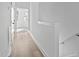 Bright hallway with light wood floors and modern trim at 4821 Gossamer Ln # 102, Raleigh, NC 27616