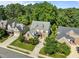 A stunning aerial view of a neighborhood showcasing lush greenery, well-maintained homes, and manicured lawns at 4913 Great Meadows Ct, Raleigh, NC 27609
