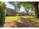 Expansive backyard featuring lush lawn, mature trees, and a patio for outdoor enjoyment at 4913 Great Meadows Ct, Raleigh, NC 27609