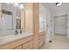 Primary bathroom featuring double vanity sinks, and neutral colored cabinets at 4913 Great Meadows Ct, Raleigh, NC 27609