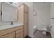 Cozy bathroom featuring a granite countertop vanity, framed mirror, and a tile surround shower at 4913 Great Meadows Ct, Raleigh, NC 27609