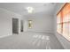 Bedroom featuring carpet, light-colored walls, a window, and two entry doors at 4913 Great Meadows Ct, Raleigh, NC 27609