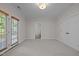 Spacious bedroom featuring neutral carpet, natural light, bathroom access, and closet at 4913 Great Meadows Ct, Raleigh, NC 27609