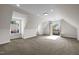 Bright bonus room featuring carpet, recessed lighting, and balcony access that provides natural light and views at 4913 Great Meadows Ct, Raleigh, NC 27609