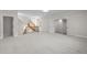 Large bonus room with stairs and carpet at 4913 Great Meadows Ct, Raleigh, NC 27609