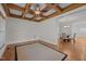 Spacious dining room featuring a decorative ceiling with wooden beams and hardwood floors at 4913 Great Meadows Ct, Raleigh, NC 27609