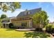Charming home exterior featuring a wooden balcony and landscaped backyard at 4913 Great Meadows Ct, Raleigh, NC 27609