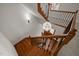 Elegant foyer featuring wood staircase, iron railings, and modern chandelier at 4913 Great Meadows Ct, Raleigh, NC 27609