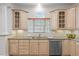 Bright kitchen with granite countertops, custom cabinets and stainless steel dishwasher at 4913 Great Meadows Ct, Raleigh, NC 27609