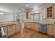Bright kitchen featuring light wood cabinets, granite counters, and stainless steel appliances at 4913 Great Meadows Ct, Raleigh, NC 27609