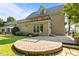 Back of house featuring a brick patio, deck and green grass at 4913 Great Meadows Ct, Raleigh, NC 27609