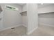 Walk-in closet with neutral carpet and window at 4913 Great Meadows Ct, Raleigh, NC 27609