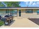 Backyard with brick patio and grill at 492 N Dunn St, Angier, NC 27501