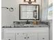 Bathroom vanity with granite countertop and black hardware at 492 N Dunn St, Angier, NC 27501