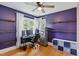 This bedroom has a ceiling fan and wood floors at 492 N Dunn St, Angier, NC 27501