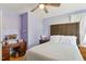 Bedroom with hardwood floors, ceiling fan, and natural light from a bright window at 492 N Dunn St, Angier, NC 27501