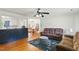 Cozy living room with hardwood floors leading to a dining area and kitchen at 492 N Dunn St, Angier, NC 27501