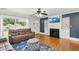 Comfortable living room featuring a fireplace, recessed lighting, and hardwood floors at 492 N Dunn St, Angier, NC 27501