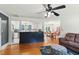 Bright and airy living room featuring hardwood floors with open access to the kitchen and dining area at 492 N Dunn St, Angier, NC 27501