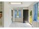 Mudroom features tile flooring, a washer and dryer closet, and a door to the outside at 492 N Dunn St, Angier, NC 27501