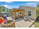 Large backyard featuring a paved patio, outdoor furniture, and a cozy pergola at 512 Wyndham Dr, Fuquay Varina, NC 27526