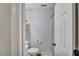 Cozy bathroom featuring light blue walls, sleek fixtures, and a stylish rounded wall shelf at 512 Wyndham Dr, Fuquay Varina, NC 27526
