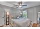Bedroom with large bed, fan, and a large window at 512 Wyndham Dr, Fuquay Varina, NC 27526