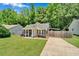 Lovely single-story home with an inviting porch and meticulously kept lawn and landscaping at 512 Wyndham Dr, Fuquay Varina, NC 27526