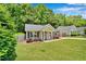 Charming one-story home with a well-manicured lawn and simple, attractive landscaping around the foundation at 512 Wyndham Dr, Fuquay Varina, NC 27526
