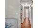Hallway with hardwood floors leading to bedrooms and bathrooms at 512 Wyndham Dr, Fuquay Varina, NC 27526