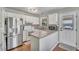 Bright kitchen featuring stainless steel appliances, granite countertops and wooden floors at 512 Wyndham Dr, Fuquay Varina, NC 27526