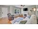 Inviting living room with a fireplace, hardwood floors, and a comfortable sofa at 512 Wyndham Dr, Fuquay Varina, NC 27526