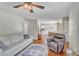 Open-concept living area with hardwood floors, leading to the kitchen and dining space at 512 Wyndham Dr, Fuquay Varina, NC 27526