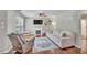 Cozy living room with a fireplace, comfortable seating, and hardwood floors at 512 Wyndham Dr, Fuquay Varina, NC 27526