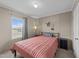 Cozy bedroom with a comfortable bed, soft lighting, and a scenic view from the large window at 540 Pine Ridge Rd, Zebulon, NC 27597