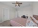 Spacious bedroom with ceiling fan, study desk and chair at 540 Pine Ridge Rd, Zebulon, NC 27597